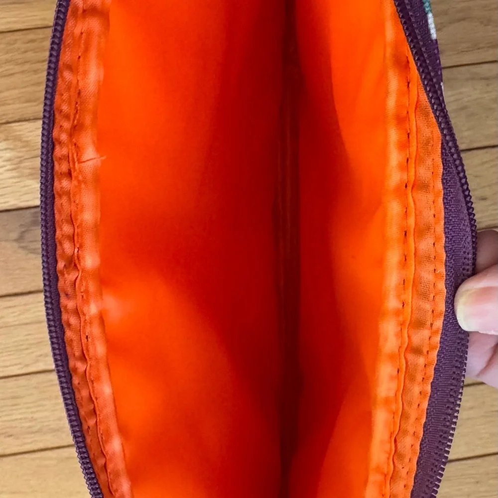 Striped Padded Laptop Sleeve - Multicolor with orange padded lining.